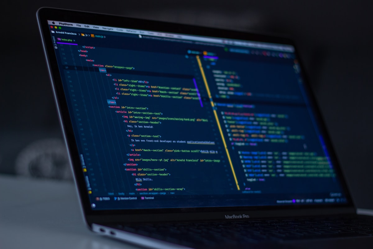 Laptop screen showing PHP code