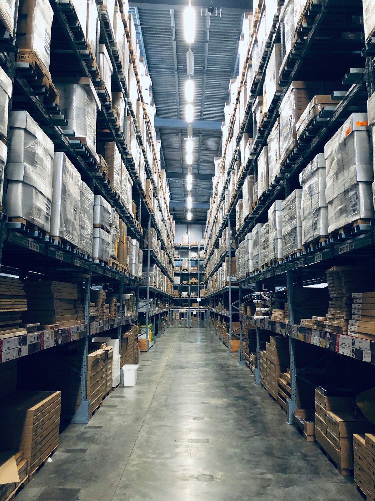 Warehouse aisle with tall racks